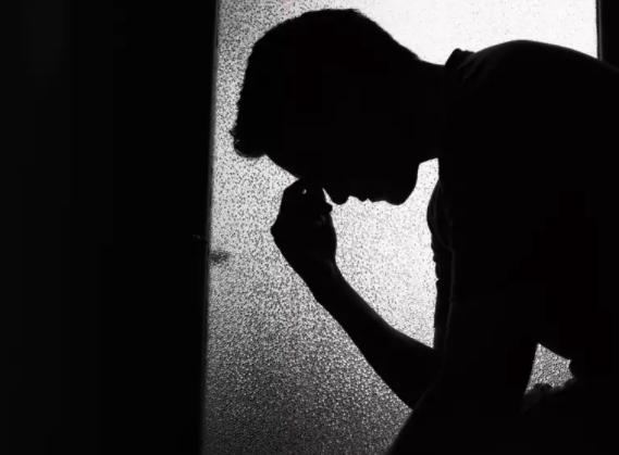 Picture (silhouette) of a man sitting